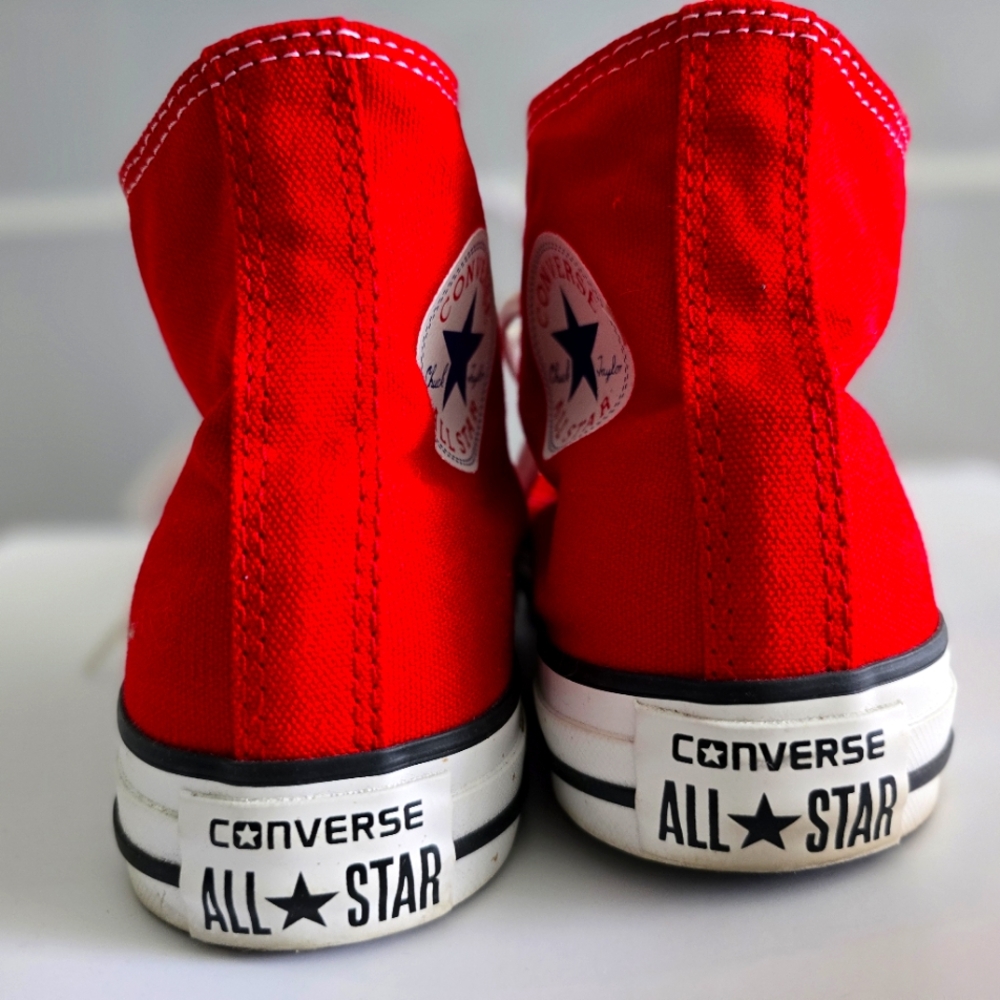 Converse red high tops.